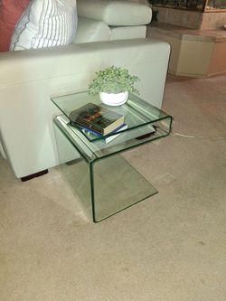 Modern clear glass side table do you want to know how high it is okay?  8.\nEen high fifteen and a half