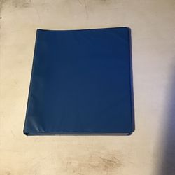 Blue binder with trading card sleeves inside