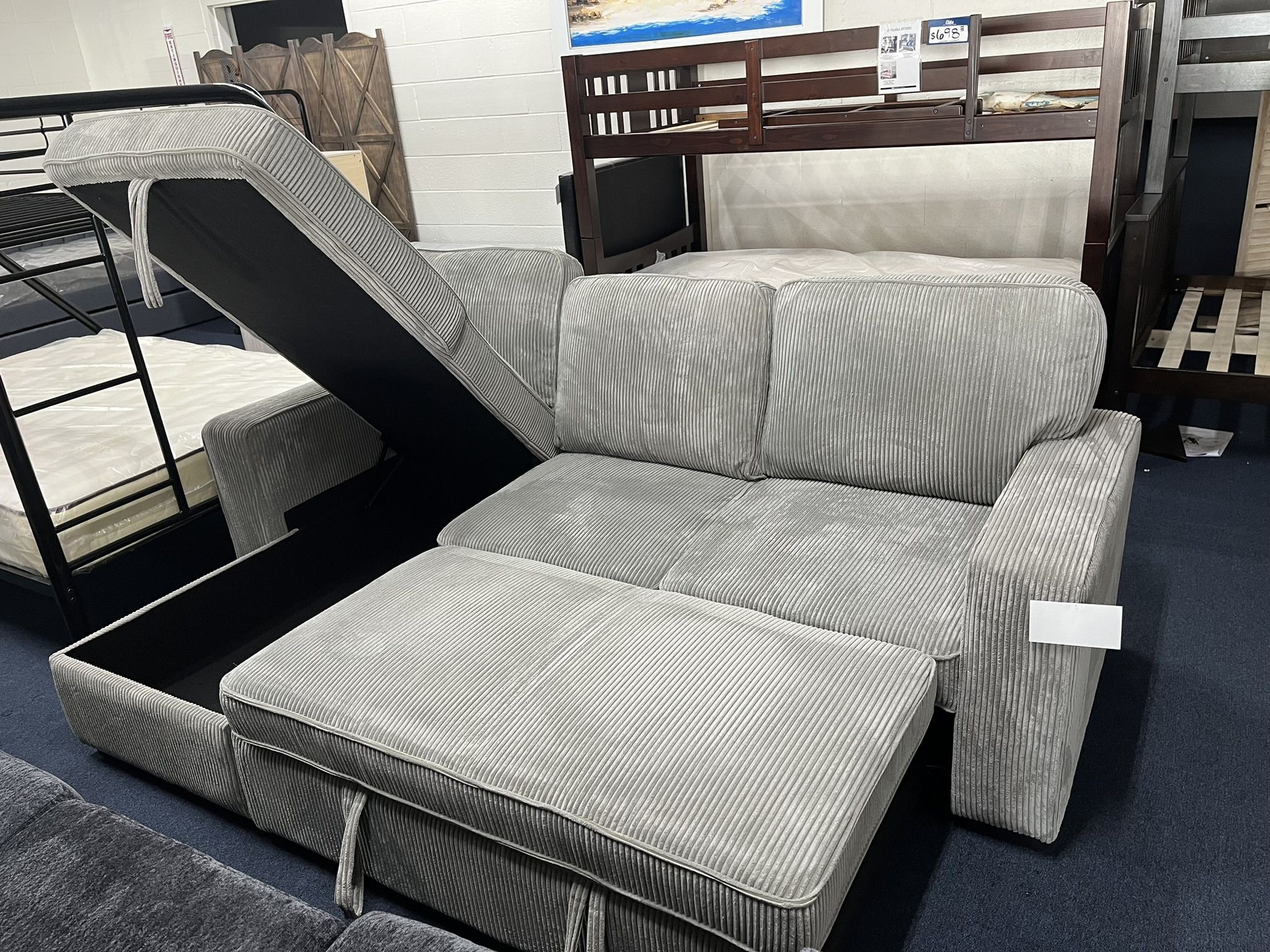 Light Grey Reversible Sectional Sleeper W/ Storage