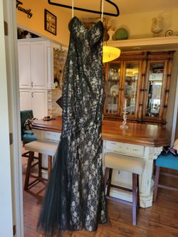 Maggie Sottero size 2, lace-up style back to fit multiple sizes.  Like new, Black lace with cream lining.