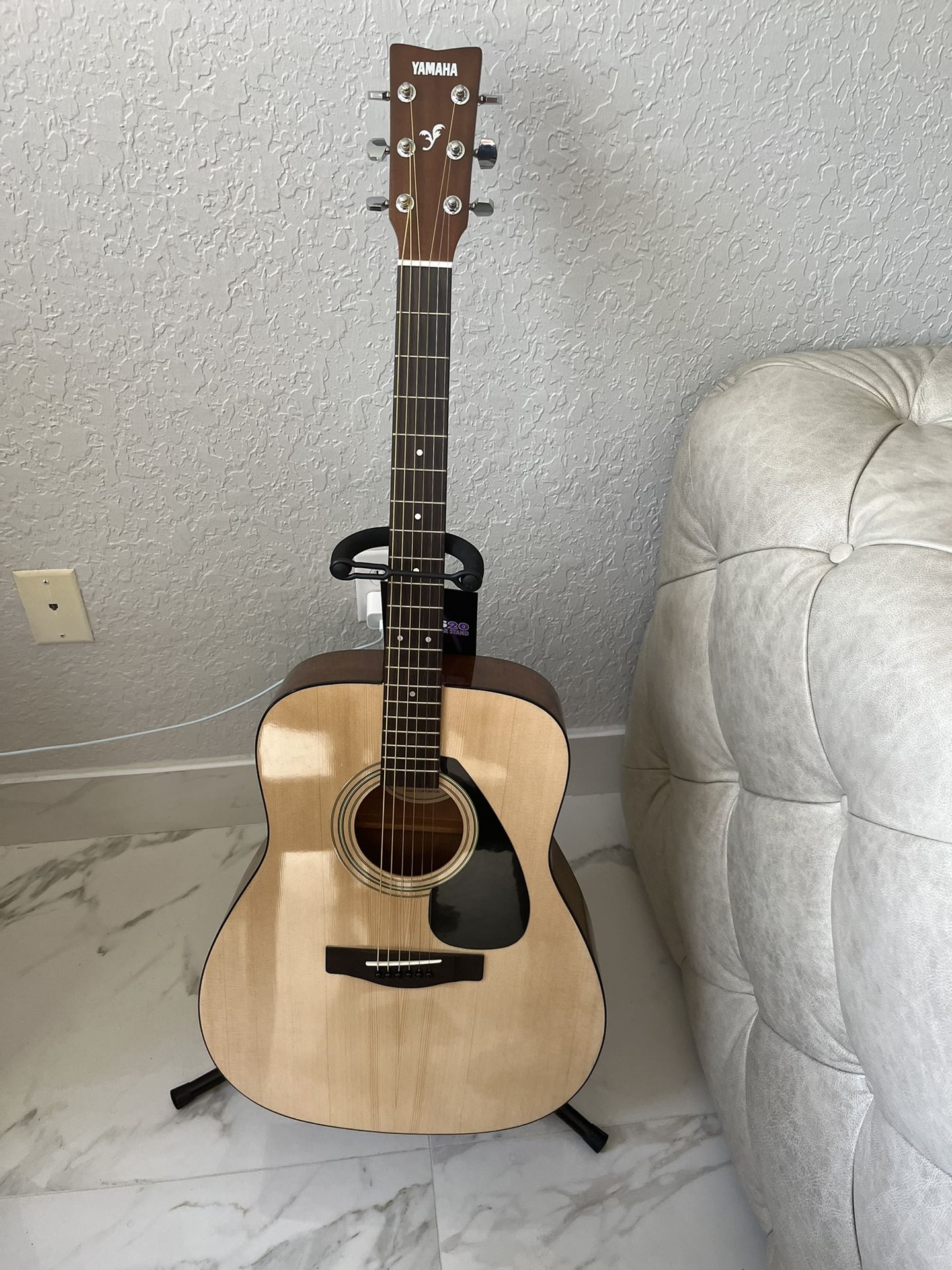 Acoustic Guitar with tuner, chips, stand, and carrying case 