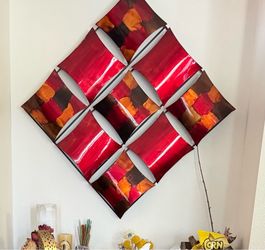 HomeRoots Shelly 9-panel metal wall decor.