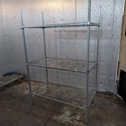 Two Commercial Shelving Units 24x48 In 74 In Tall A bit Rusty
