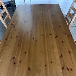 Heavy duty wooden dining table and 4 chairs (Ikea)