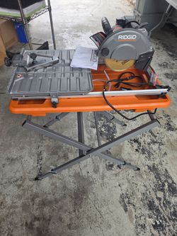 RIDGID 9 Amp. 7 in. Job Site Wet Tile Saw with stand In Excellent Condition! New 7" cutter wheel!! Retails $405 with Taxes!!