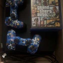 PS4 SLIM with 2 controllers, gta 5, 3 random games, and a power cord.