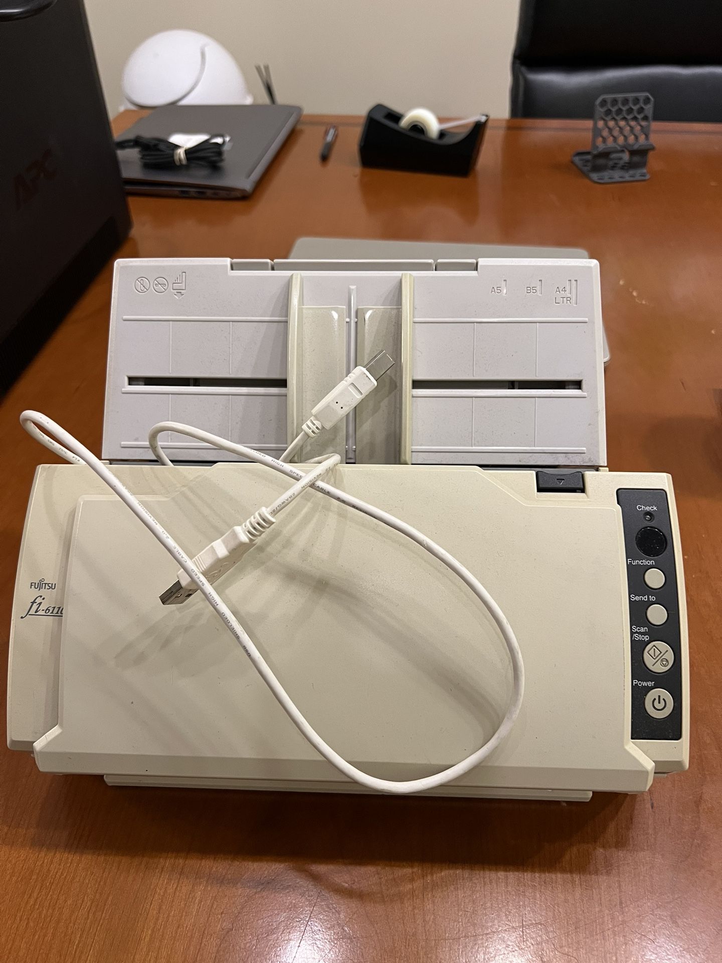 Fujitsu fi-6110 document scanner. It is a workgroup scanner designed for desktop use, featuring high-speed scanning and a compact desig