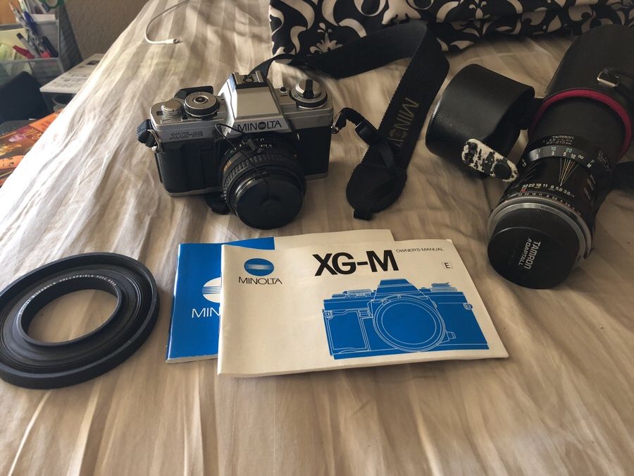 Minolta XG-m film camera with 50mm and telephoto lenses plus accessories