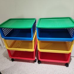 Two plastic toy shelves with wheel