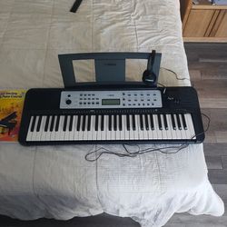 Yamaha Keyboard with Self Teaching Piano Book Course And Headphones