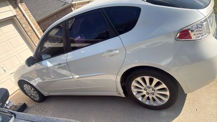 White Subaru Impreza Sedan