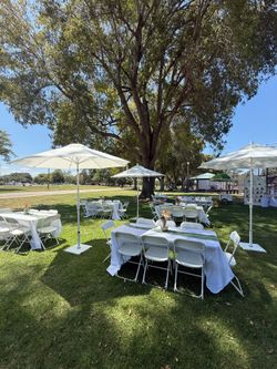 Tables chairs with umbrellas