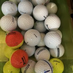 Box of assorted golf balls