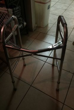 Walker with adjustable legs