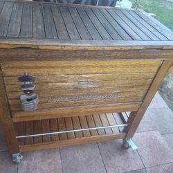 Tommy Bahama 100 Quart Rolling Wood Cooler