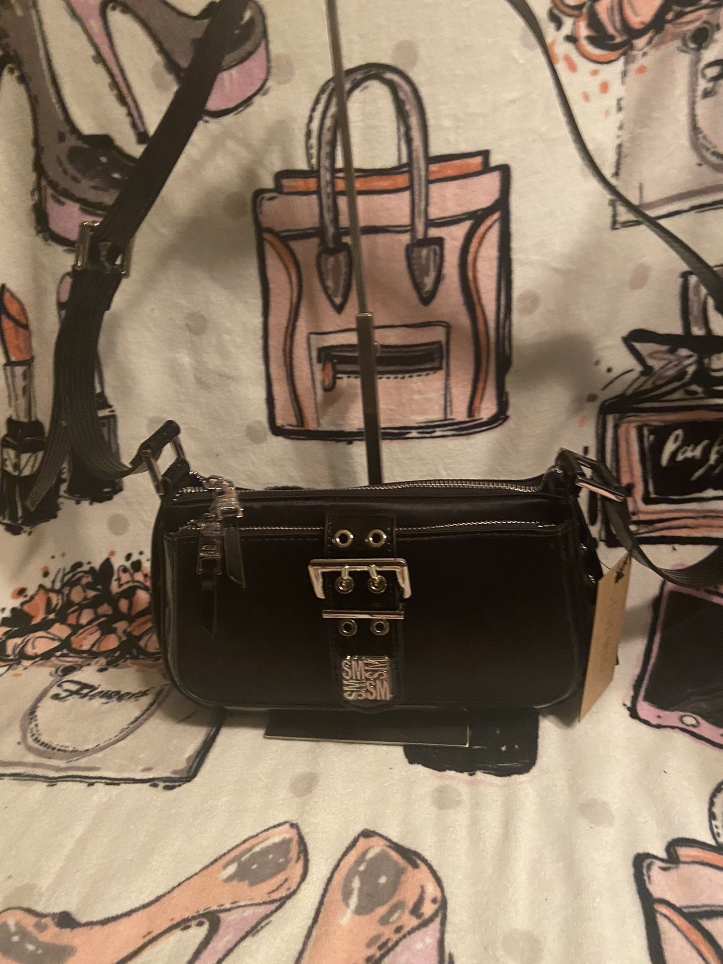 Authentic brand, new Steve Martin, black leather/canvas, Crossbody bag, black and color with silver hardware the scrap is not removable does not come