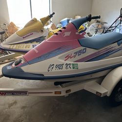 Two jet skis with trailer current tags  lift vests