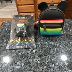 Disney lot of two items:  Disney Parks Pride Collection Mickey Mouse Loungefly Wristlet Brand New With Tags .  Size 6 inches tall with ears 7 1/2 inch