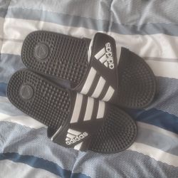 Adidas flip flops.