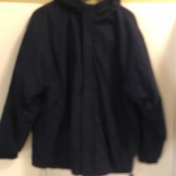 Mens Blue windbreaker jacket with hood by Basic Concepts size Medium, w/ phone pocket/ side pocket on left arm in very good condition. Interior is lig