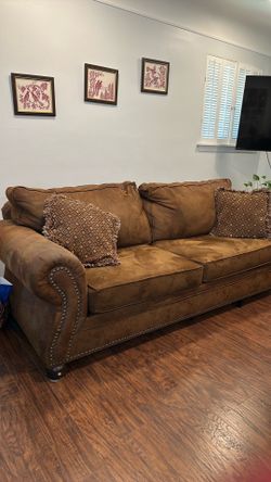 Brown sofa and loveseat