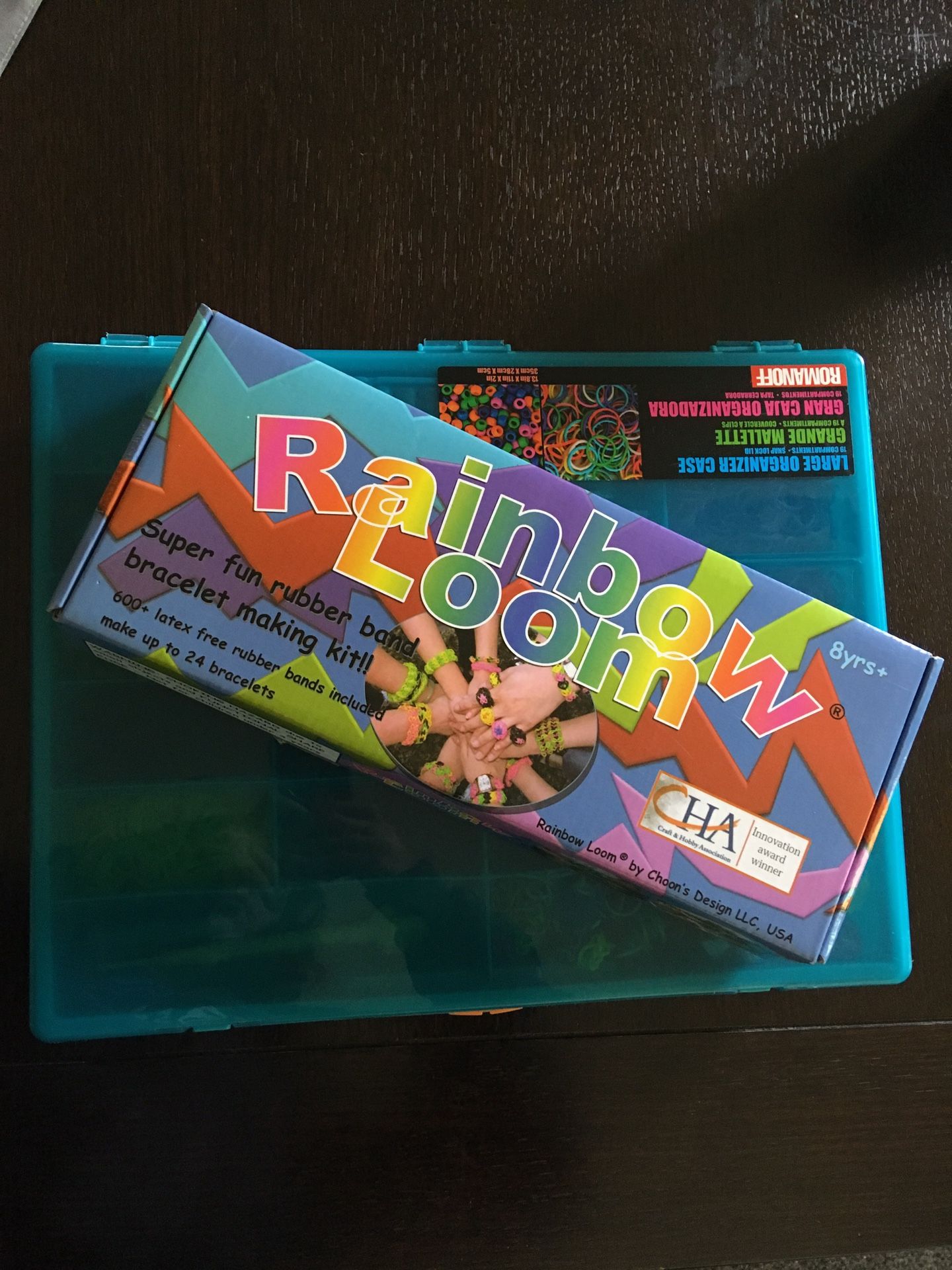 Rainbow Loom and assorted bands and clips in storage container