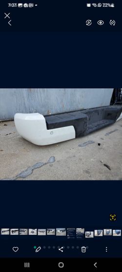 2022- 2024 NISSAN FRONTIER REAR
BUMPER WITH SENSORS USED OEM .NC