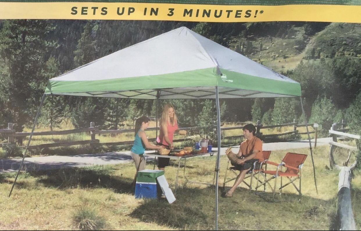 12x10 Slantwall Coleman tent, roll carry bag and tie down stakes
