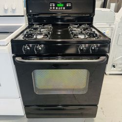 GE black stove, includes a receipt with a 60-day warranty.