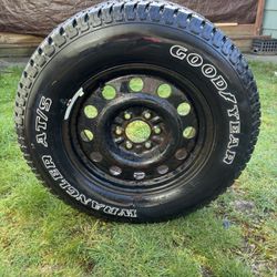 275/65 R18 Ford rim and tire