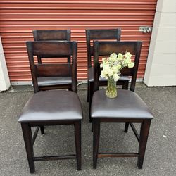 woodwn high table and four chairs and a bench