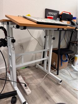 Adjustable desk with wheel brand new!!