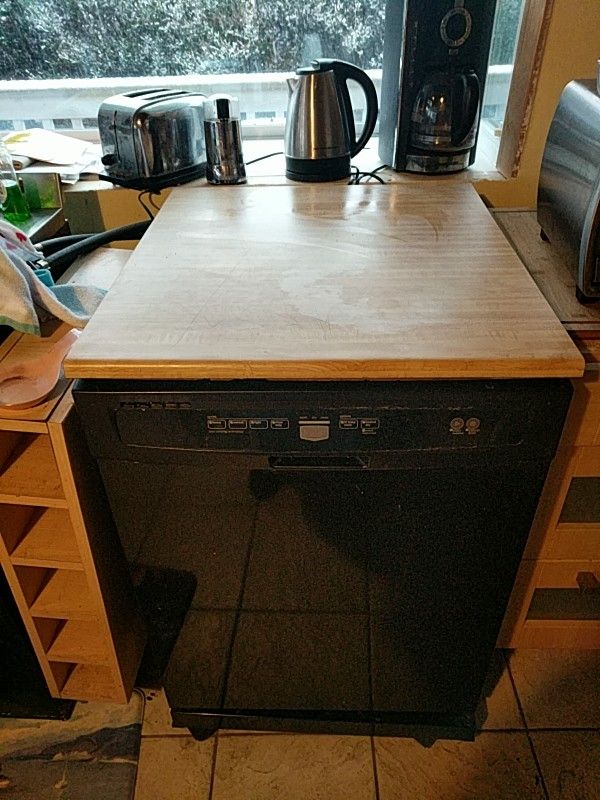 Portable Maytag dishwasher. Works great. Black with butcher block top