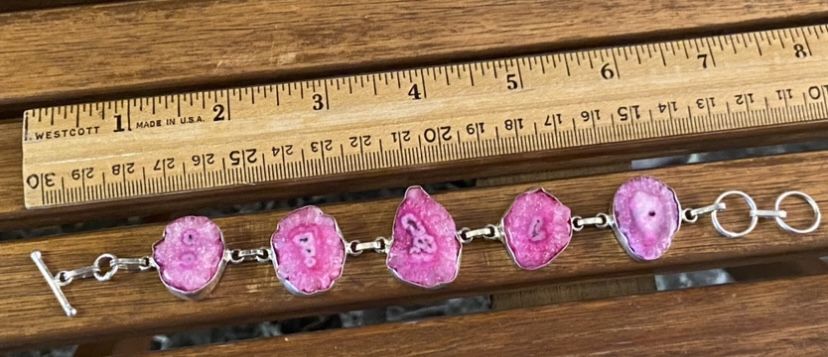 Several Stamped Silver And Geode Slice Bracelets Available