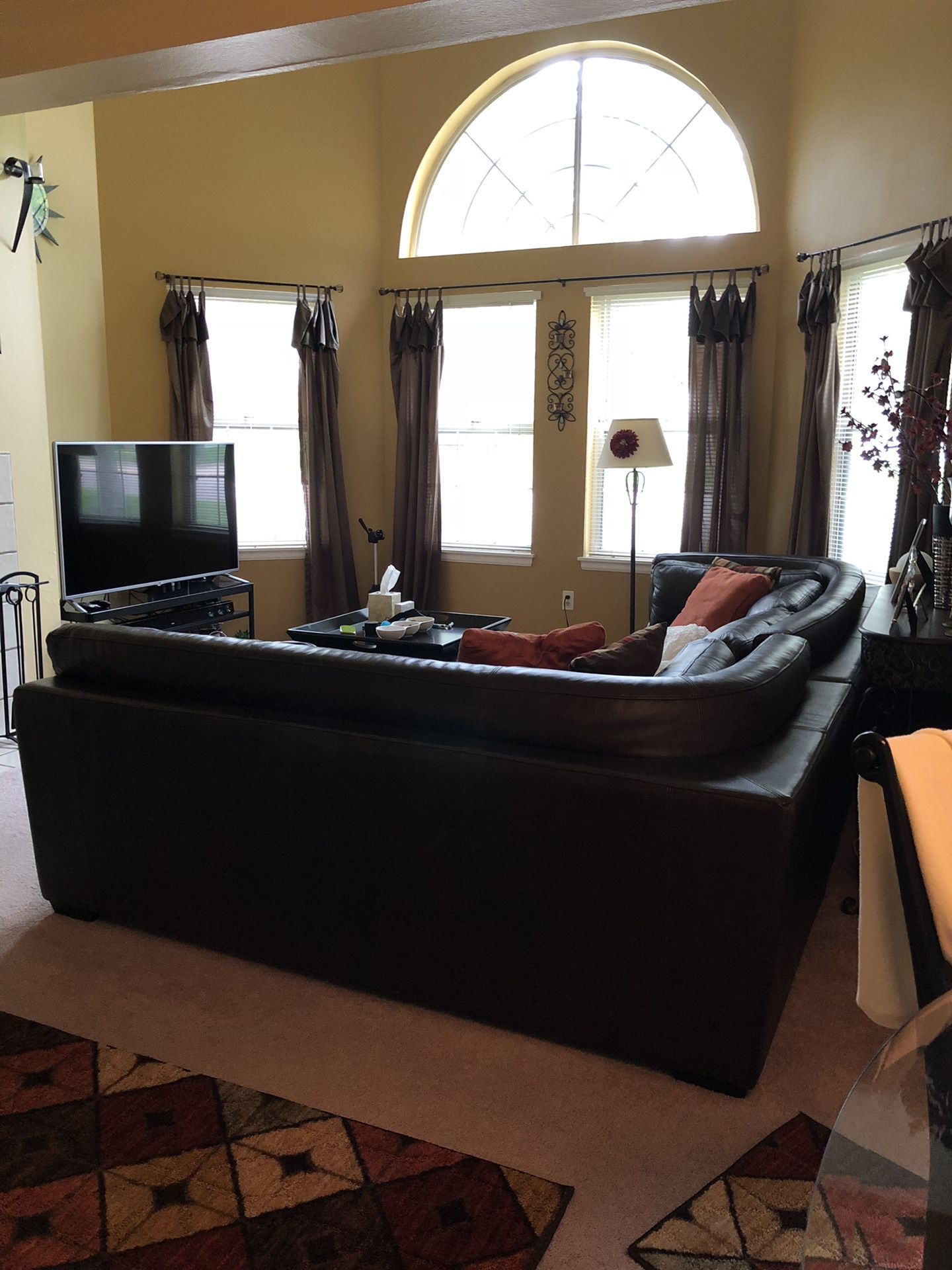 Brown Leather Sectional w/ Ottoman At the back of sections 2 each 77x40 Ottoman 3ft x 3ft