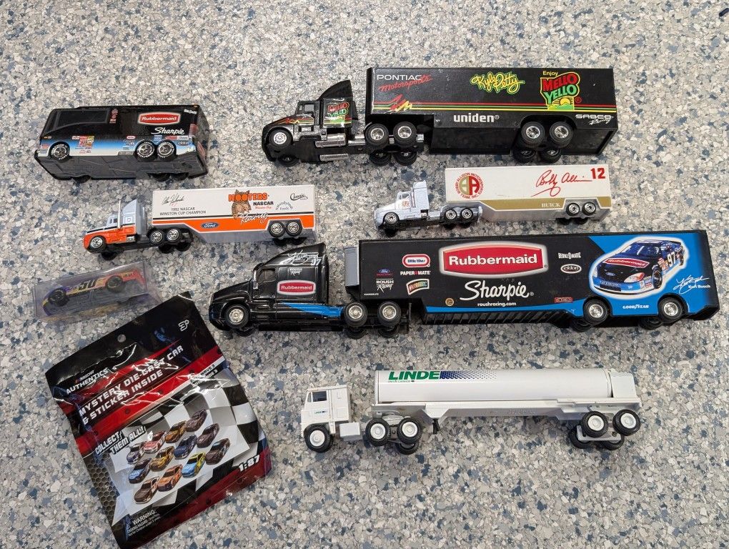 Box lot of NASCAR toy trucks and cars