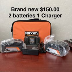 2 Batteries 1 Charger $150.00 New Plus A Soft Bag 