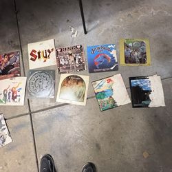 2 large bins of vinyl record Albums pictures show the classic rock bands these are in rough shape. The Albums seem to be in good shape just need to be