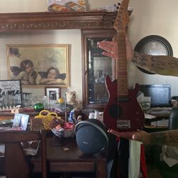 Electric guitar with built in amplifier