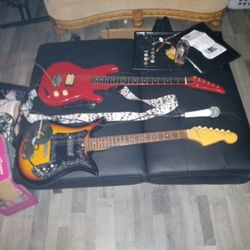 Two.  Guitars 2 Mics Two Plugs For Guitats For Amp Wires For Microphones As Well Cruise Guitar And One 1968 Vintage Guitar One Shure Mic One Dynamic M