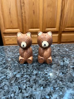 Vintage Ceramic Swirl Design Bear pair of Salt and Pepper Shakers.  Preowned.  Approximately 3 inches tall.  Stamped on the bottom Japan.