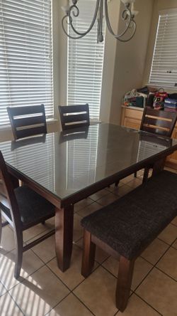Dinning table , 4chair bench and table cover glass.
