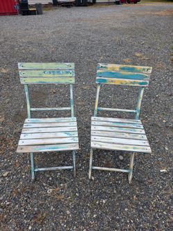 2 folding wooden chairs
