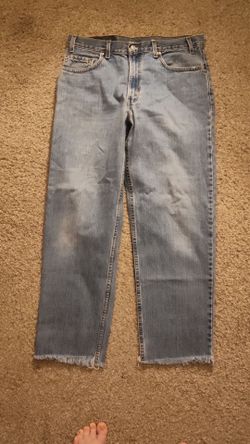 Vintage Levi's 550 Light Wash Jeans Raw Hem Size 35