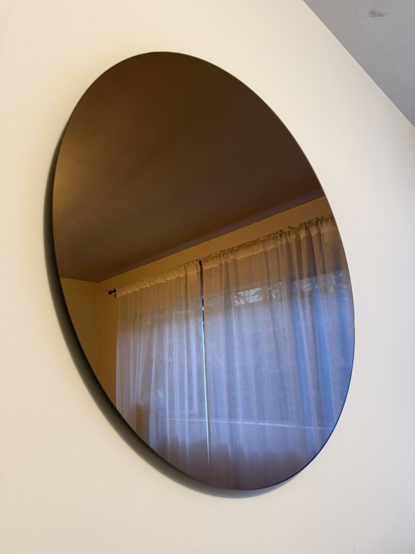 Two Different Round Mirrors