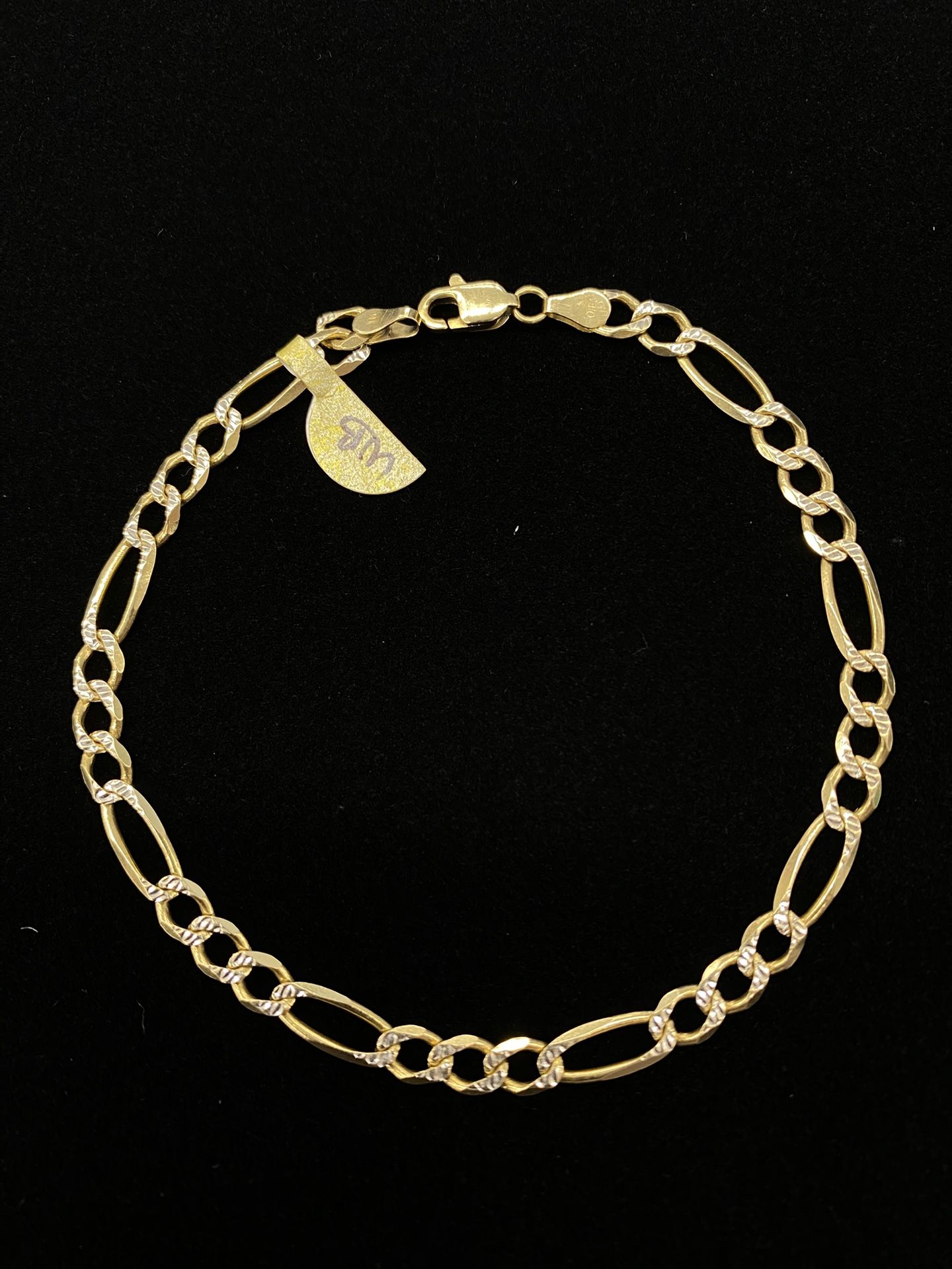 $725 Two Tone Gold Figaro Bracelet