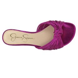 Jessica Simpson Dydra knotted slide sandal in a bright pink metallic finish. 