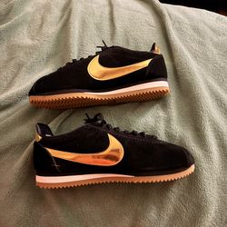 Nike Black and Gold Shoes
