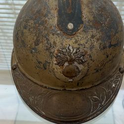 World War I M1915 French Army Artillery Adrian helmet with Great War veteran brass helmet plaque