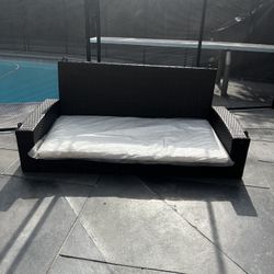 Patio Swing With White Cushions